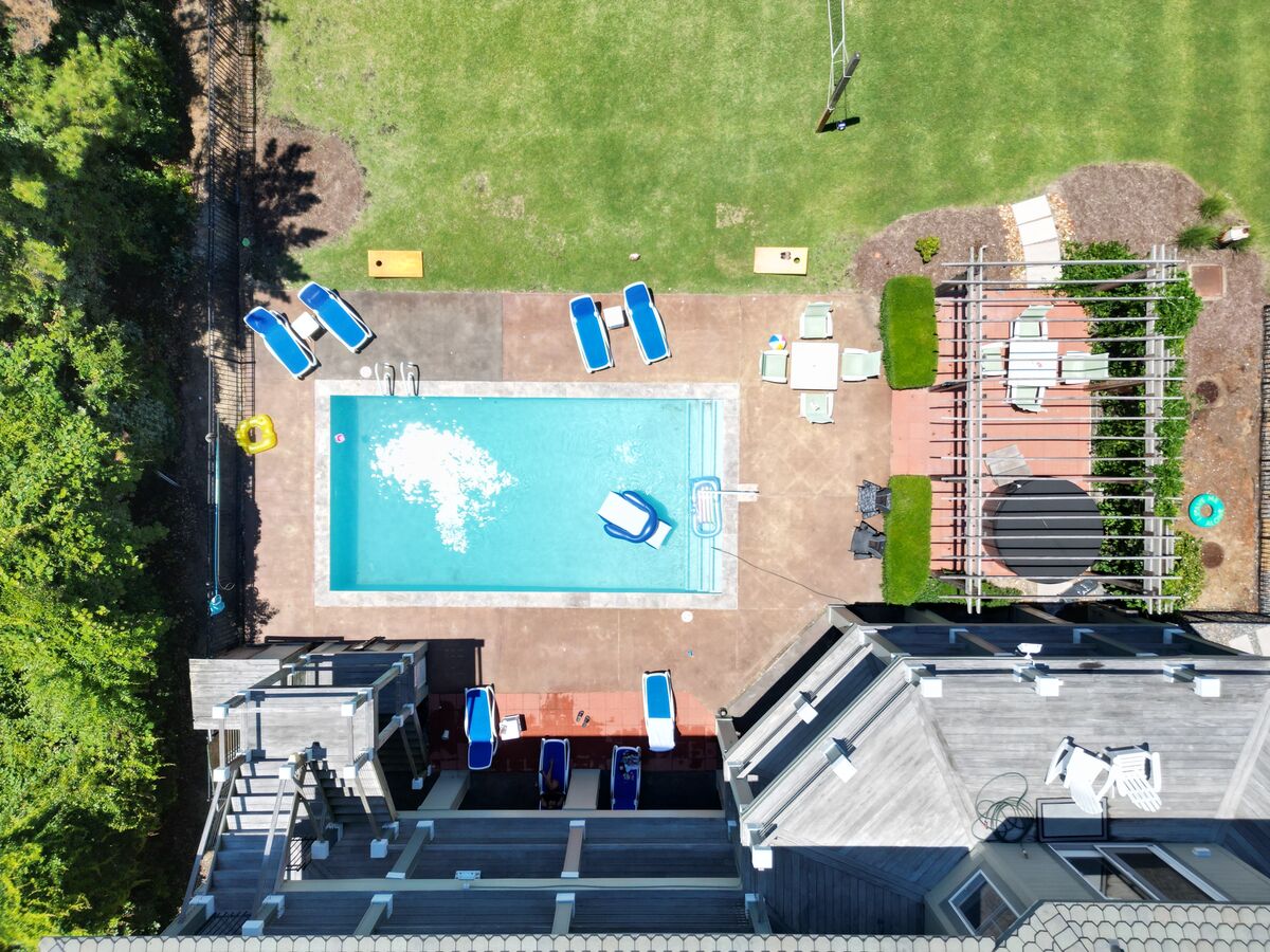 Aerial top-down view of a real estate property with pool and patio